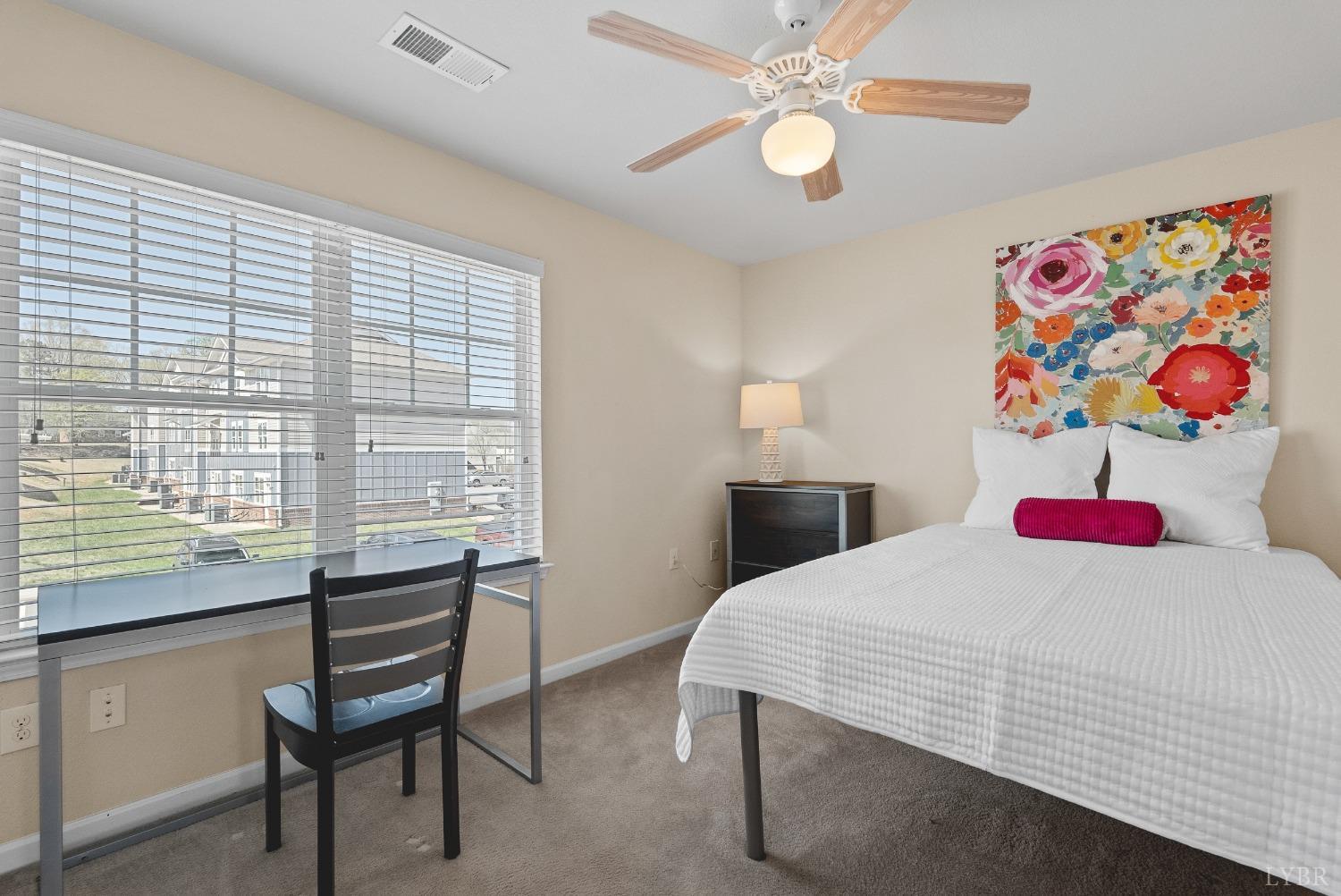 1600 Wards Ferry Road, Unit 704 Lynchburg, VA 24502 - Photo 24 of 49 a bedroom with a bed and a table