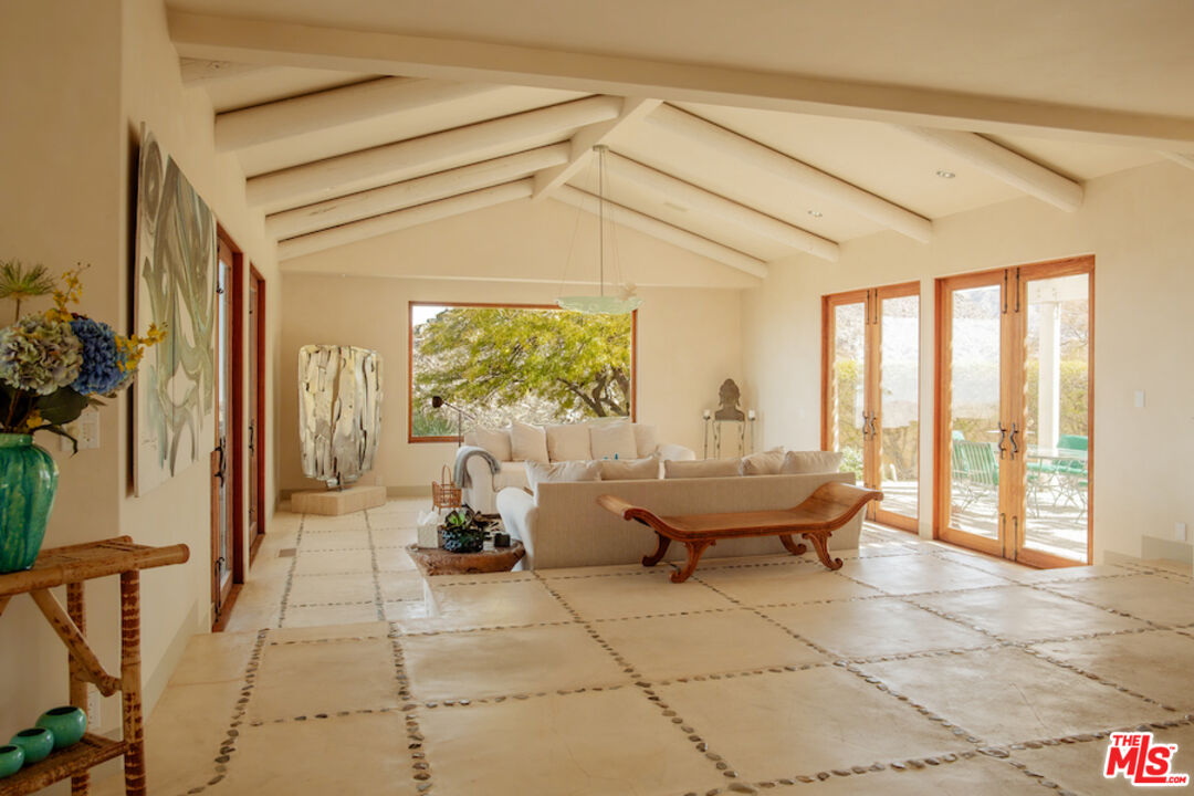 57425 Palm Seco Circle Mountain Center, CA 92561 - Photo 13 of 61 a living room with furniture and a large window
