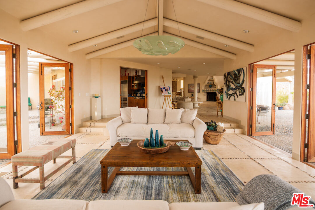 57425 Palm Seco Circle Mountain Center, CA 92561 - Photo 17 of 61 a living room with furniture and a large window