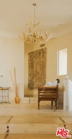 a view of hallway with furniture and a window