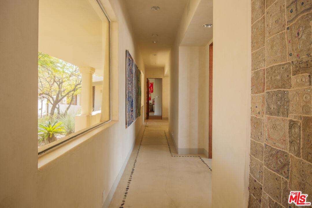 57425 Palm Seco Circle Mountain Center, CA 92561 - Photo 22 of 61 a view of hallway with furniture and a window