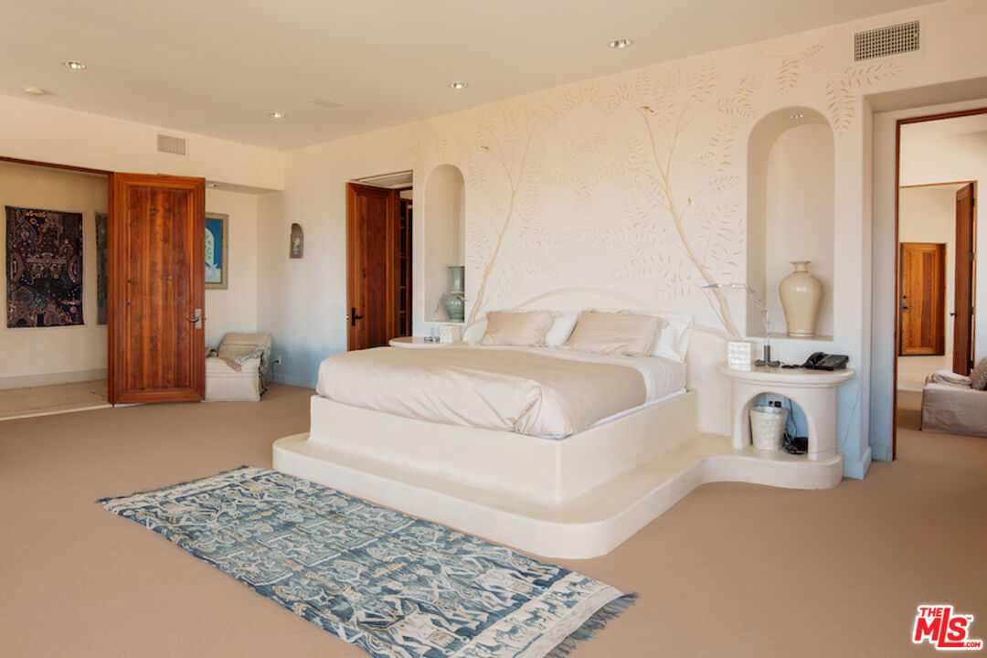 57425 Palm Seco Circle Mountain Center, CA 92561 - Photo 25 of 61 a bedroom with a large bed and a couch