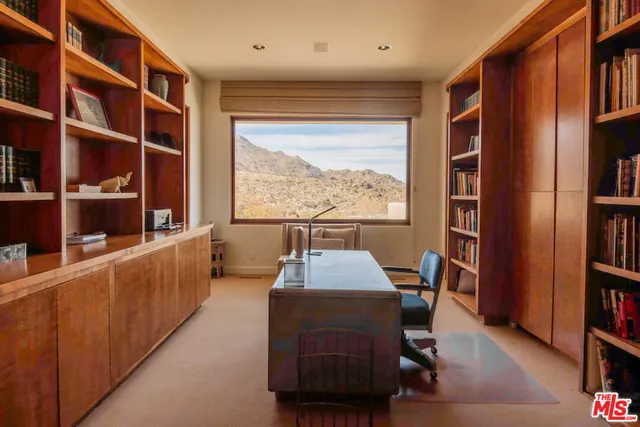 a bathroom with a bathtub and a window