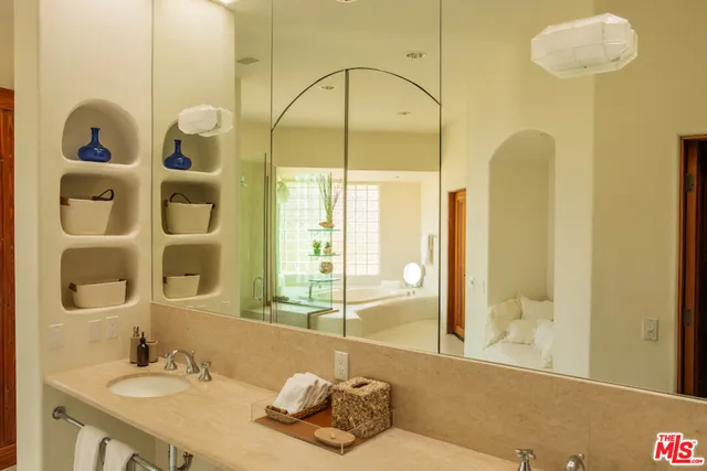 a bathroom with a sink and a mirror