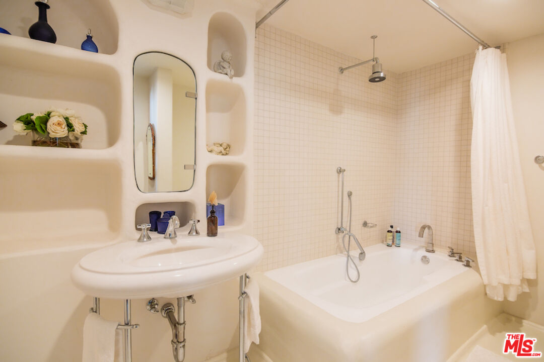 57425 Palm Seco Circle Mountain Center, CA 92561 - Photo 32 of 61 a bathroom with a sink and a mirror