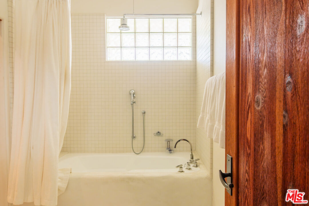 57425 Palm Seco Circle Mountain Center, CA 92561 - Photo 34 of 61 a bathroom with a tub and shower