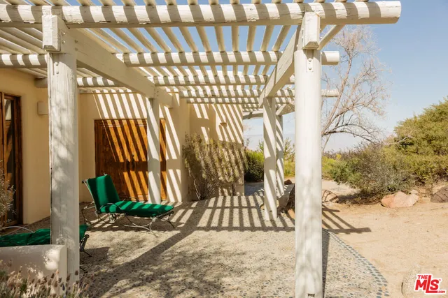 a bedroom with a bed and a wall painting