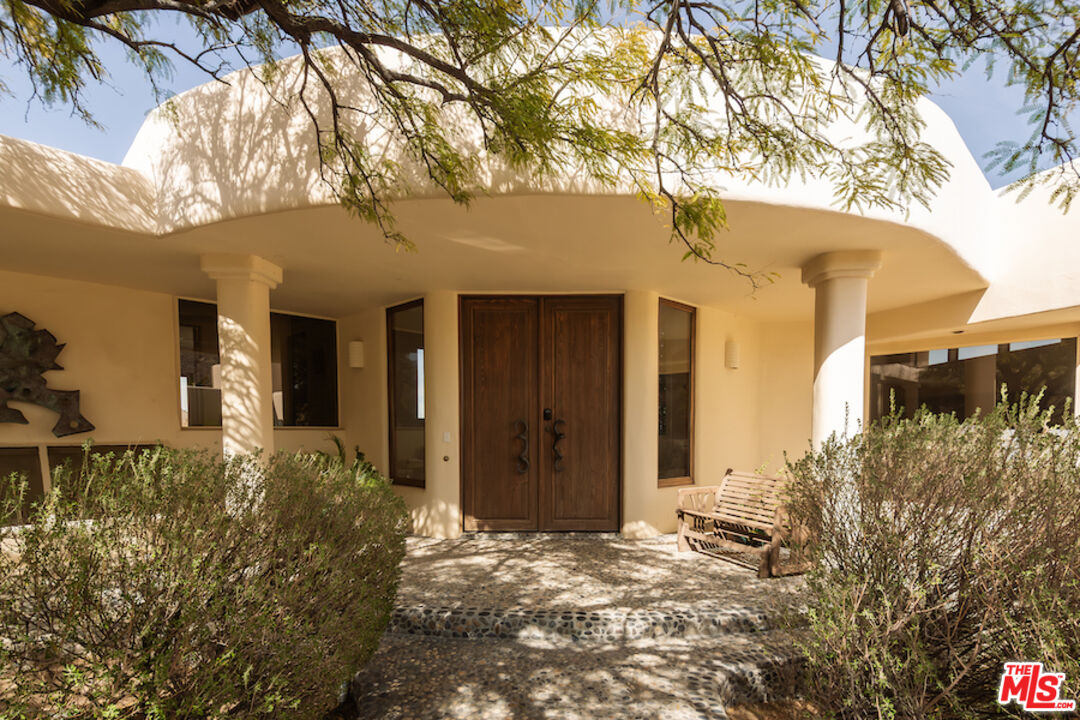 57425 Palm Seco Circle Mountain Center, CA 92561 - Photo 5 of 61 front view of a house with a yard