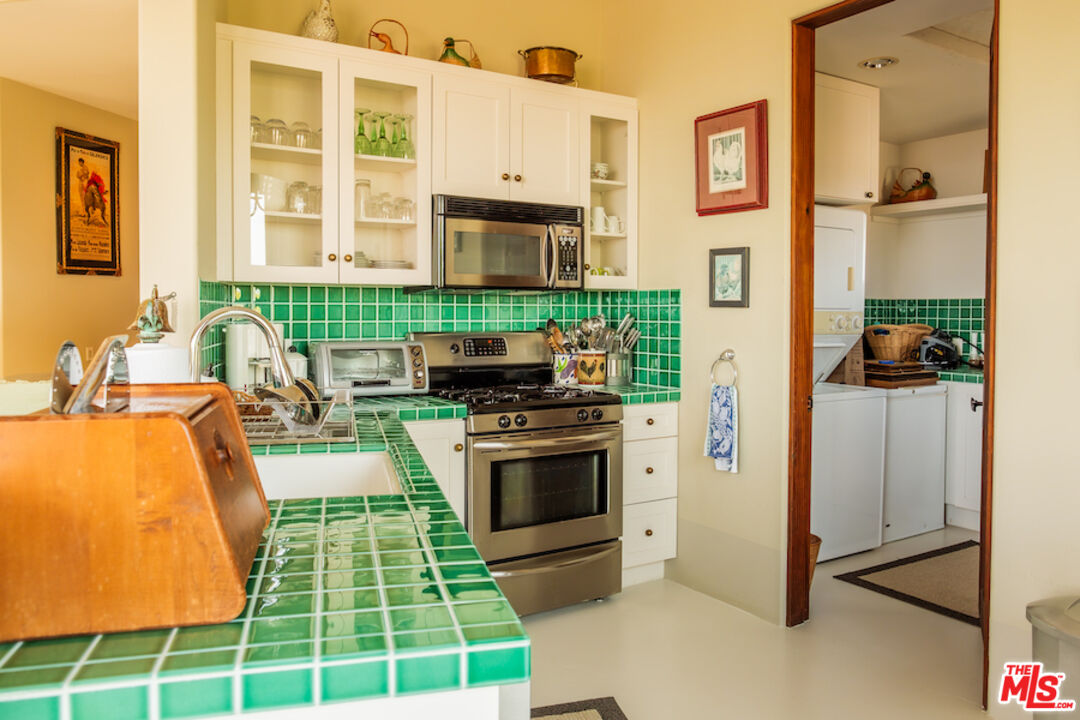57425 Palm Seco Circle Mountain Center, CA 92561 - Photo 51 of 61 a kitchen with kitchen island a stove and a sink