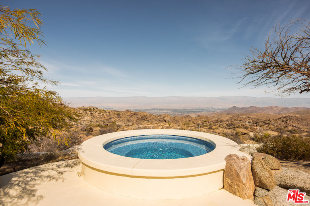 57425 Palm Seco Circle Mountain Center, CA 92561 - Photo 58 of 61 a view of a swimming pool with a garden