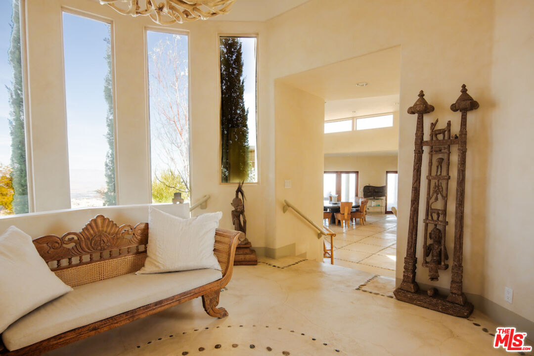 57425 Palm Seco Circle Mountain Center, CA 92561 - Photo 7 of 61 a living room with furniture and a table