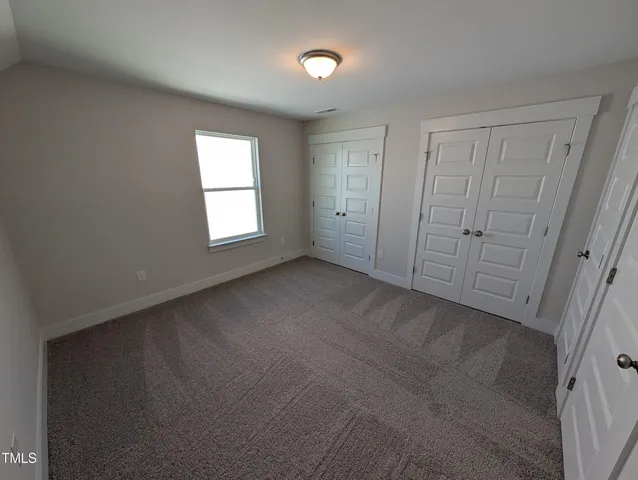 a view of a large building with a big yard