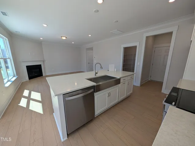 a kitchen with a sink and a refrigerator