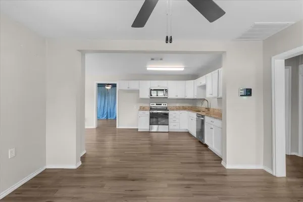 a view of kitchen with wooden floor
