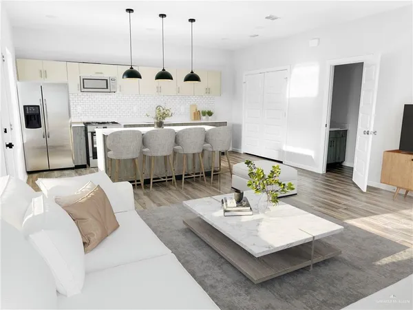 a living room with furniture and wooden floor