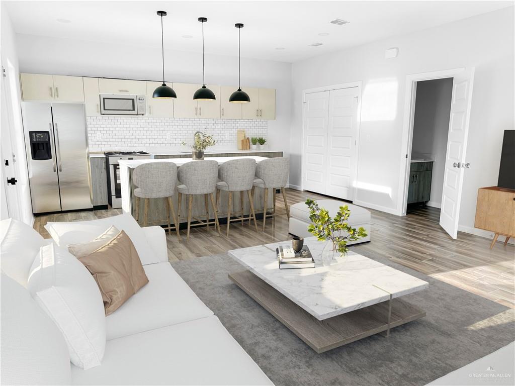 4801 Tyler Avenue, Unit 2 McAllen, TX 78503 - Photo 5 of 19 a living room with furniture and wooden floor