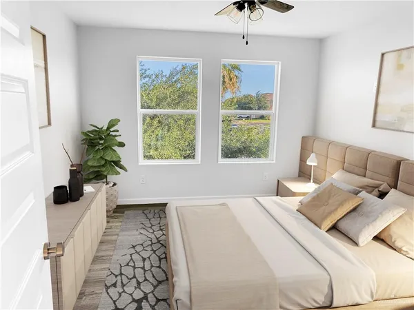 a bedroom with bed and a window