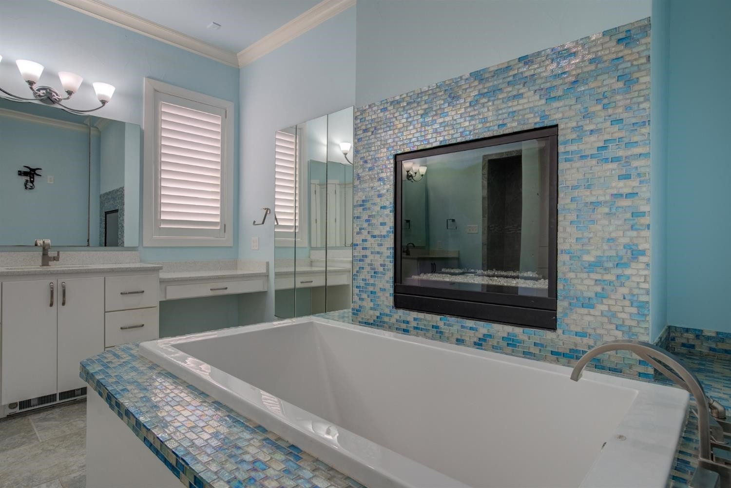 4002 113th Street Lubbock, TX 79423 - Photo 25 of 50 a bathroom with a granite countertop tub sink and mirror