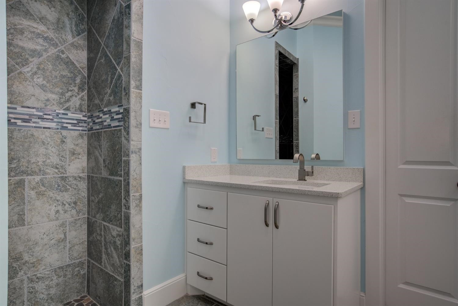 4002 113th Street Lubbock, TX 79423 - Photo 27 of 50 a bathroom with a double vanity sink a and a mirror