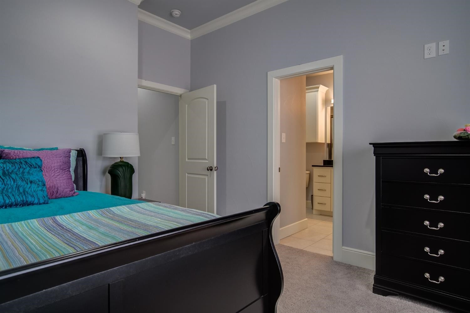 4002 113th Street Lubbock, TX 79423 - Photo 28 of 50 a bedroom with a bed and a dresser