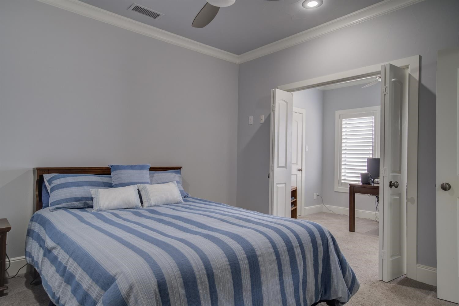 4002 113th Street Lubbock, TX 79423 - Photo 35 of 50 a bedroom with a bed and a mirror