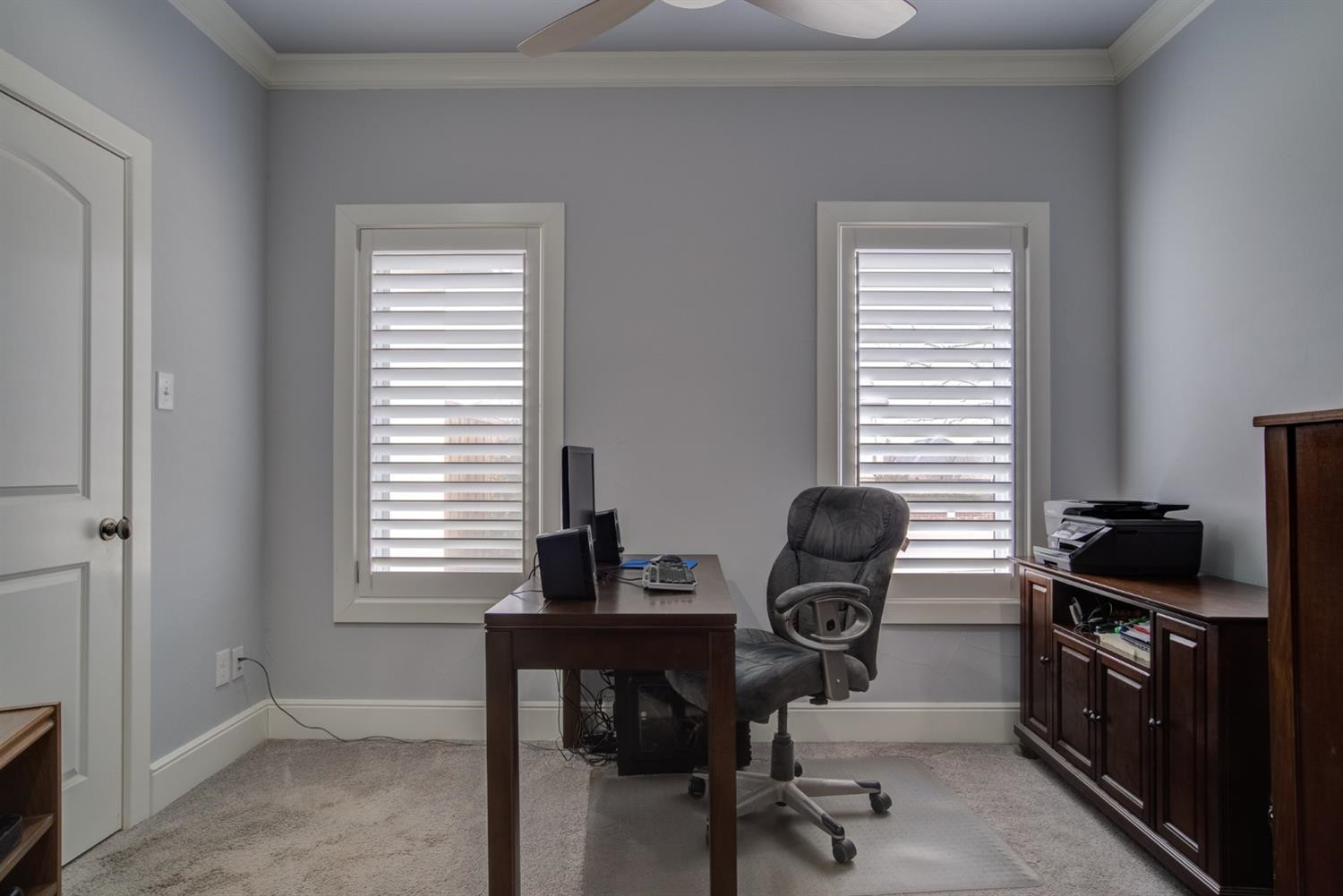 4002 113th Street Lubbock, TX 79423 - Photo 36 of 50 a view of a workspace with furniture and a window