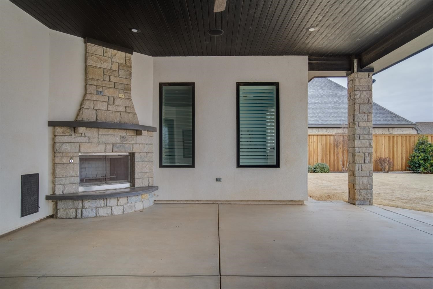 4002 113th Street Lubbock, TX 79423 - Photo 45 of 50 a view of an empty room with a fireplace and a window