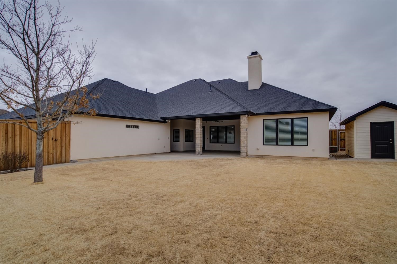 4002 113th Street Lubbock, TX 79423 - Photo 48 of 50 a front view of a house with a yard