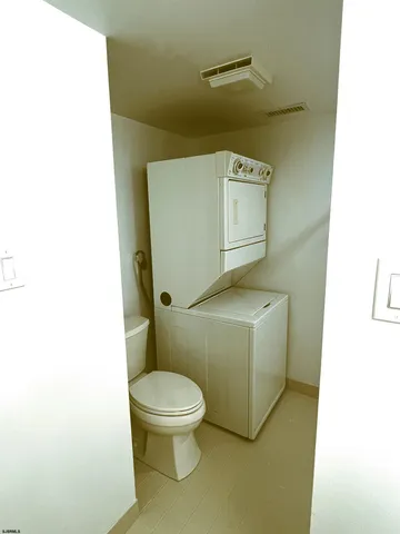 a bathroom with a shower and a toilet