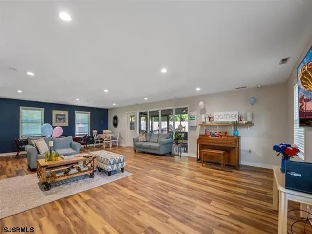 a living room with furniture and a table