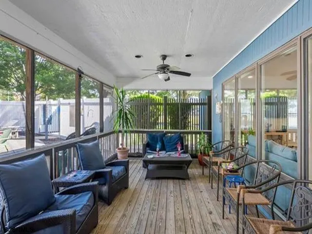 a kitchen with a sink a refrigerator and cabinets