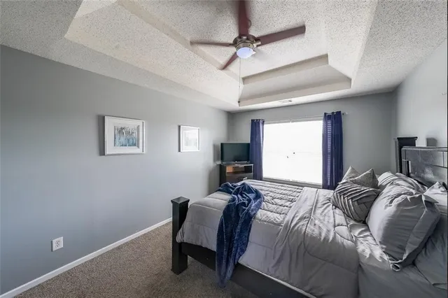 a bed room with a bed and a window