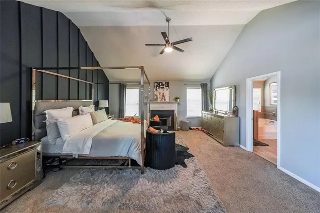 a bed room with a bed and a fireplace