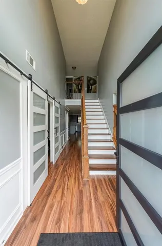 a view of entryway with wooden floor