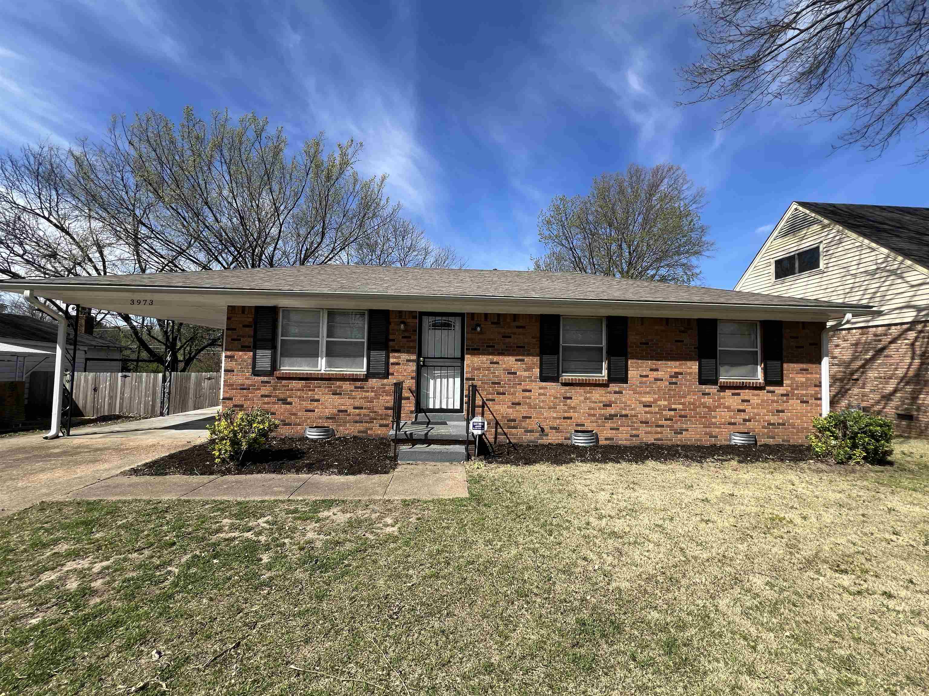 3973 Brompton Road Memphis, TN 38118 - Photo 1 of 17 Ranch-style house with crawl space, driveway, an attached carport, and brick siding