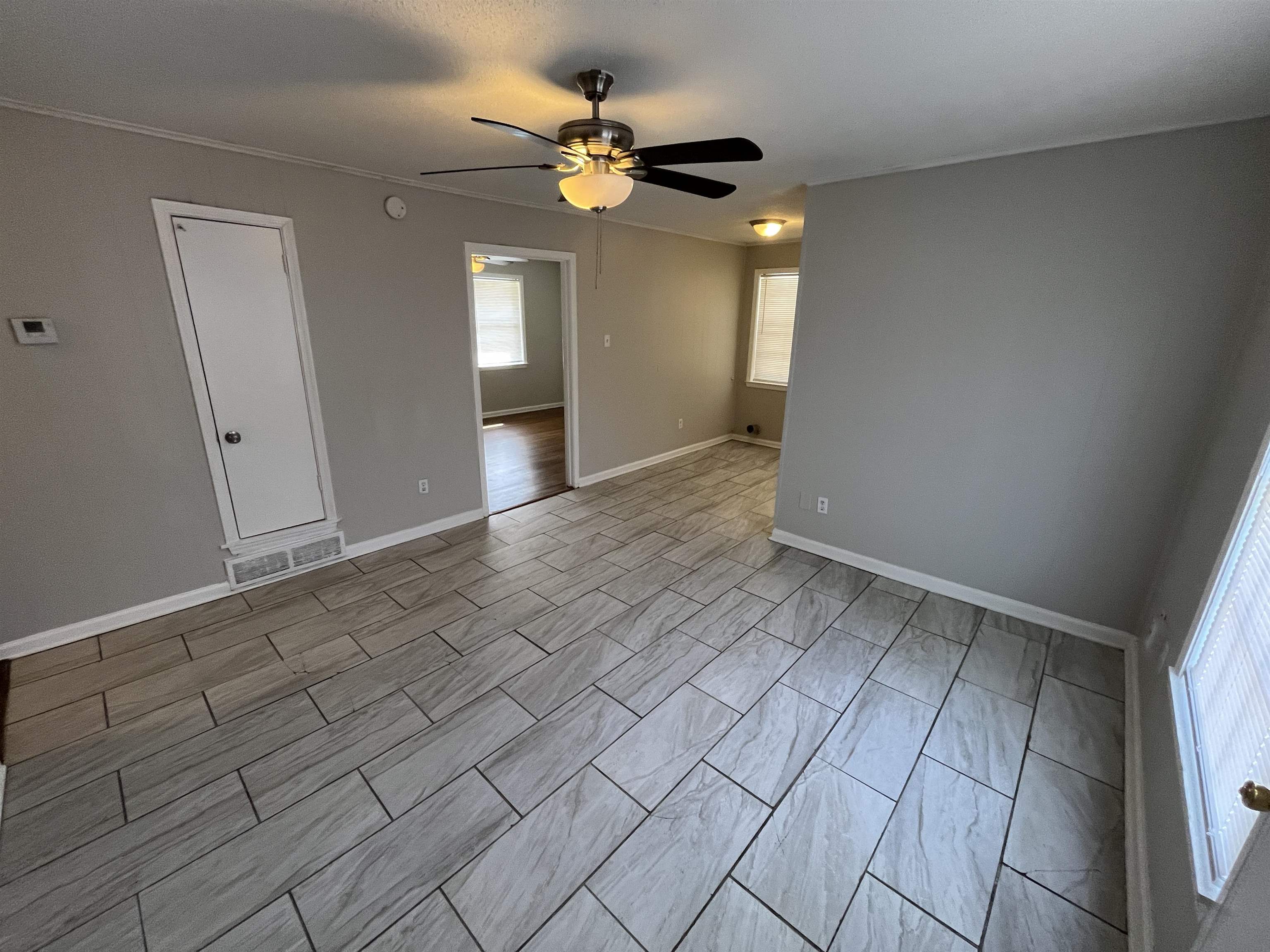3973 Brompton Road Memphis, TN 38118 - Photo 5 of 17 Spare room featuring baseboards, ceiling fan, and visible vents
