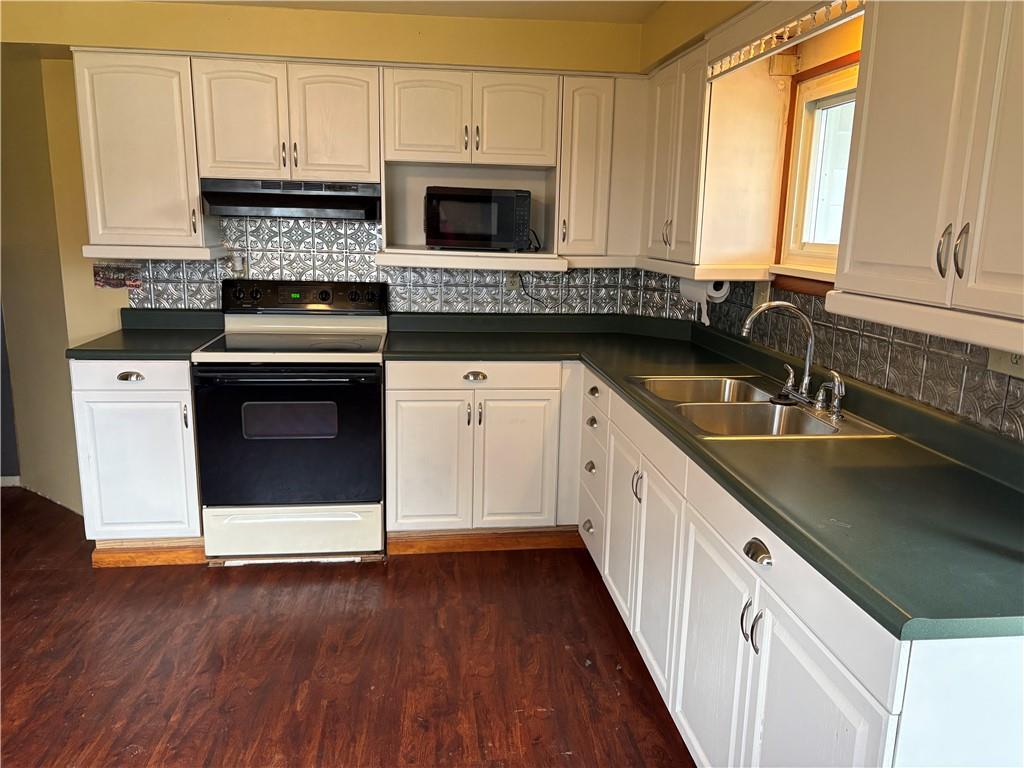 5 1st Street Star Junction, PA 15482 - Photo 7 of 20 a kitchen with granite countertop a sink and a stove top oven