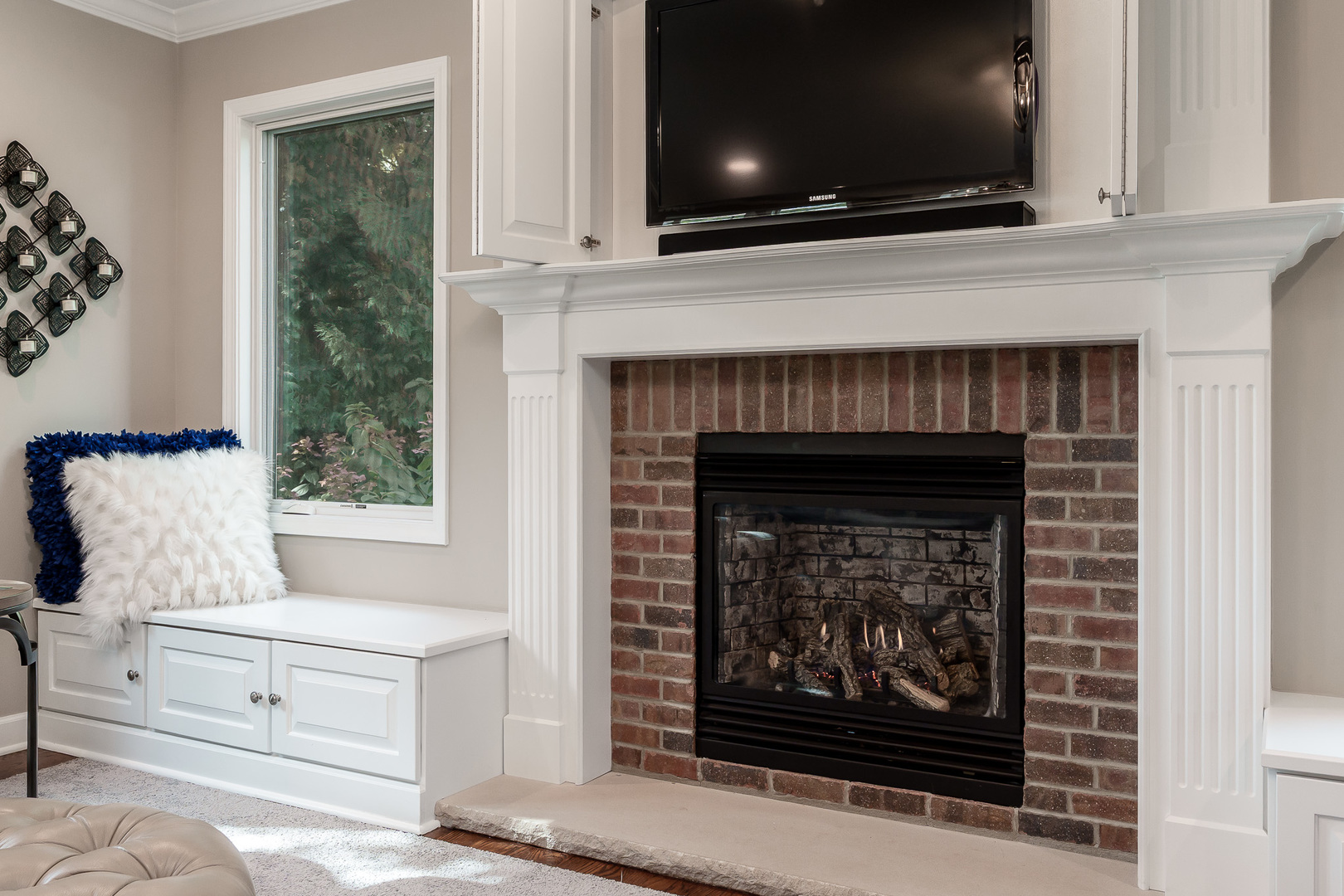 8551-8589 Rote Road Rockford, IL 61107 - Photo 15 of 89 a living room with a fireplace and a flat screen tv