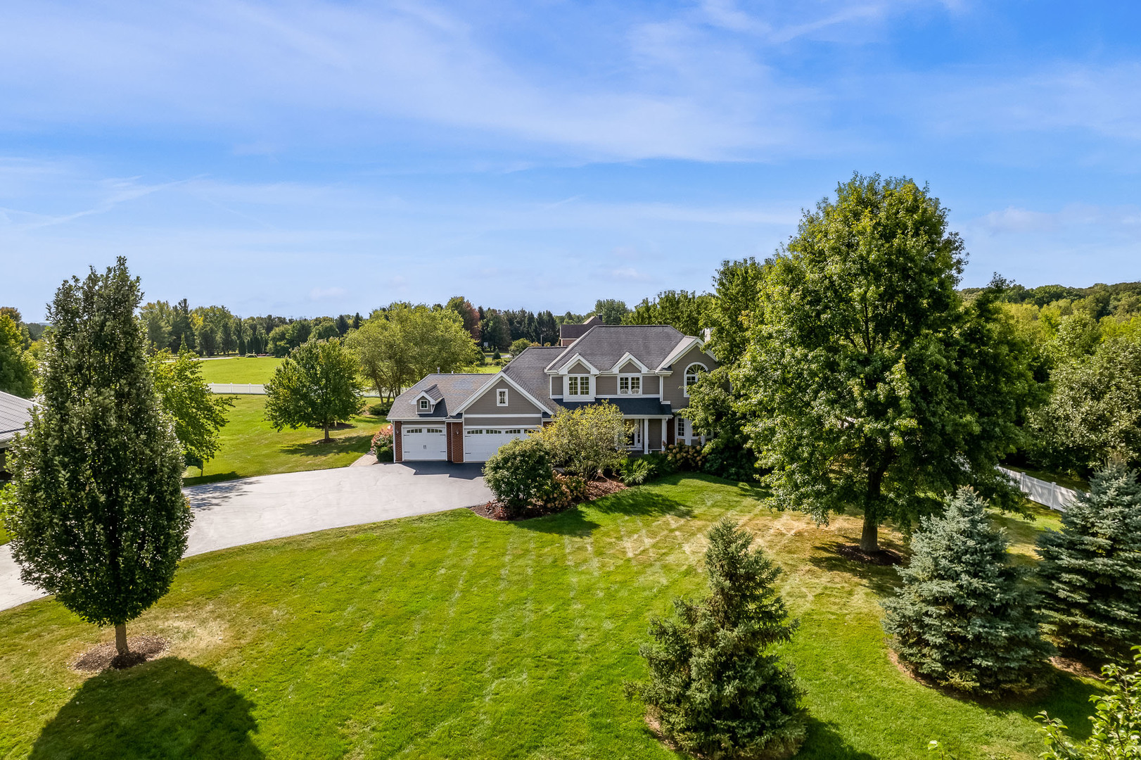 8551-8589 Rote Road Rockford, IL 61107 - Photo 66 of 89 a view of a garden with a building in the background