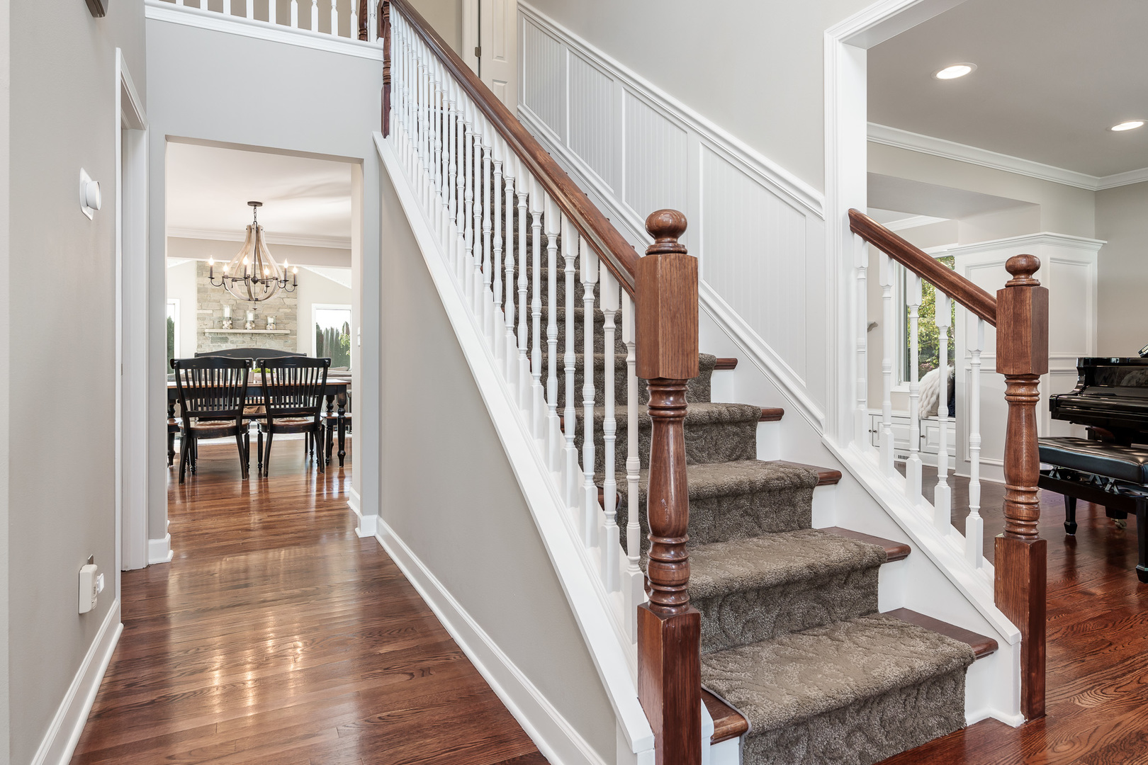 8551-8589 Rote Road Rockford, IL 61107 - Photo 9 of 89 a view of staircase with lots of frames on wall and windows