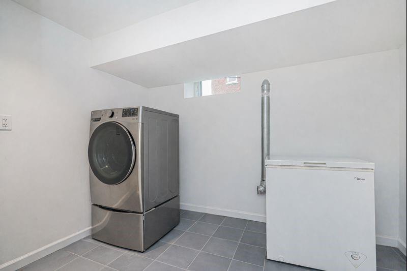 104 Village Road South Brooklyn, NY 11223 - Photo 22 of 36 a utility room with dryer and washer