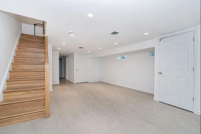 a view of an empty room and stairs
