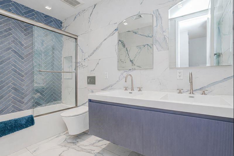 104 Village Road South Brooklyn, NY 11223 - Photo 30 of 36 a bathroom with a sink and a mirror