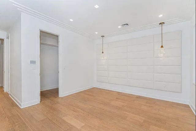 a view of empty room with a fan