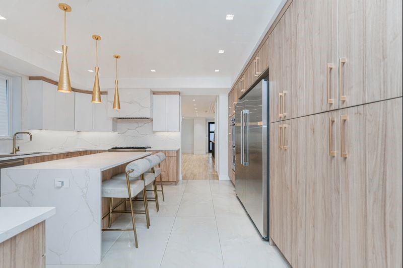 104 Village Road South Brooklyn, NY 11223 - Photo 10 of 36 a kitchen with a sink appliances and cabinets
