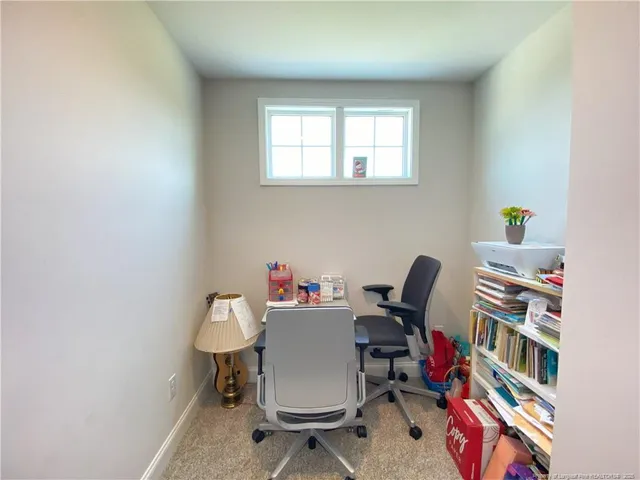 a workspace with furniture and book shelf