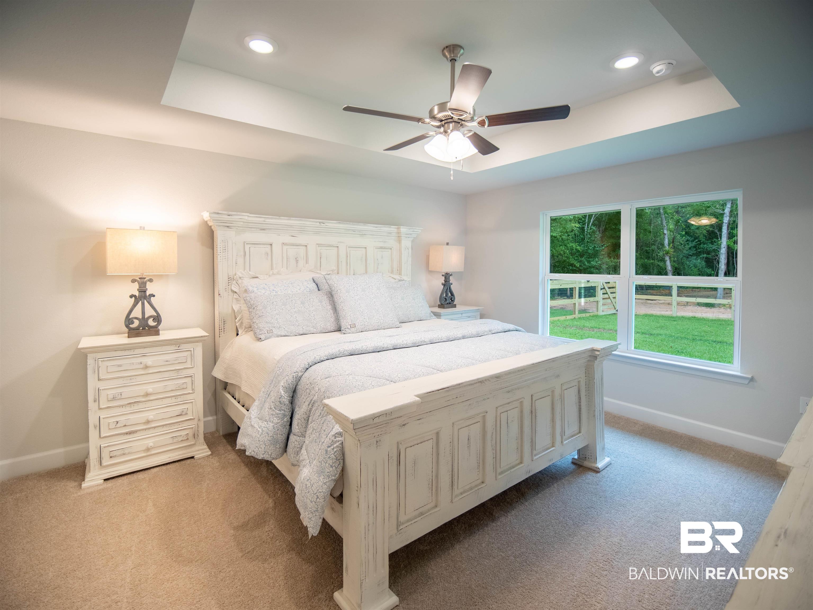 12646 Michigan Avenue Elberta, AL 36530 - Photo 14 of 47 Bedroom with a tray ceiling, light colored carpet, recessed lighting, and ceiling fan