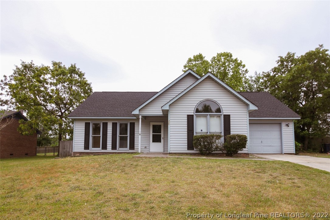 220 Overton Road Raeford, NC 28376 - Photo 1 of 30 a front view of house with yard and trees around