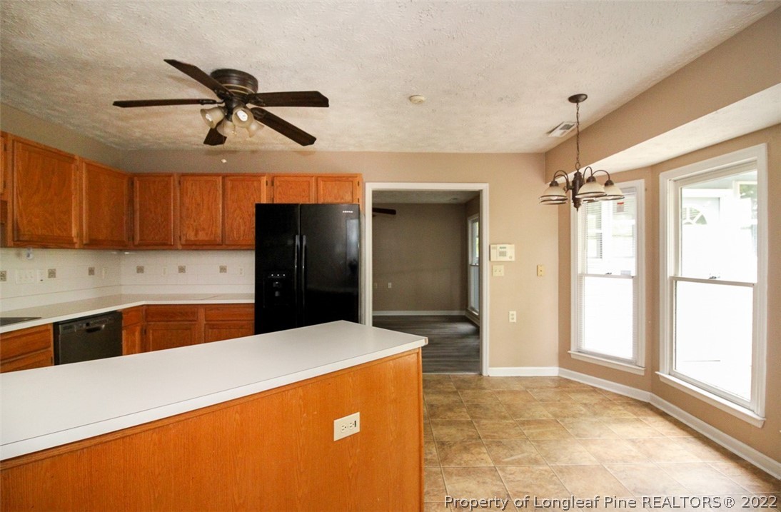 220 Overton Road Raeford, NC 28376 - Photo 11 of 30 a kitchen with stainless steel appliances a refrigerator sink and cabinets