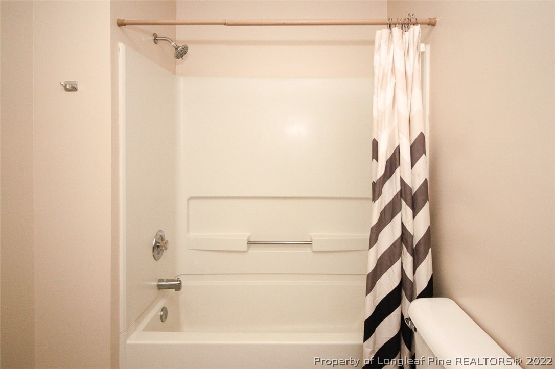 220 Overton Road Raeford, NC 28376 - Photo 13 of 30 a bathroom with a shower and a toilet